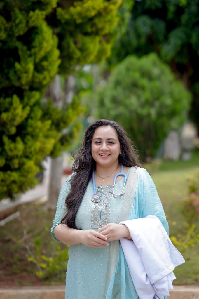 Dr. S Sanjana Devi with stethoscope and coat